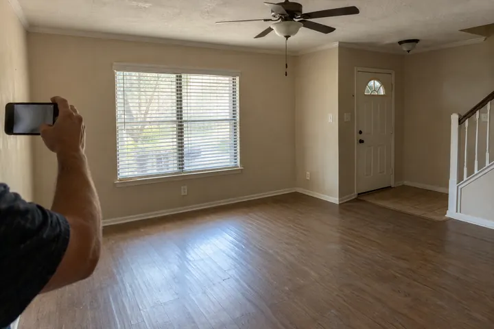 Taking a completion photo of a cleared room